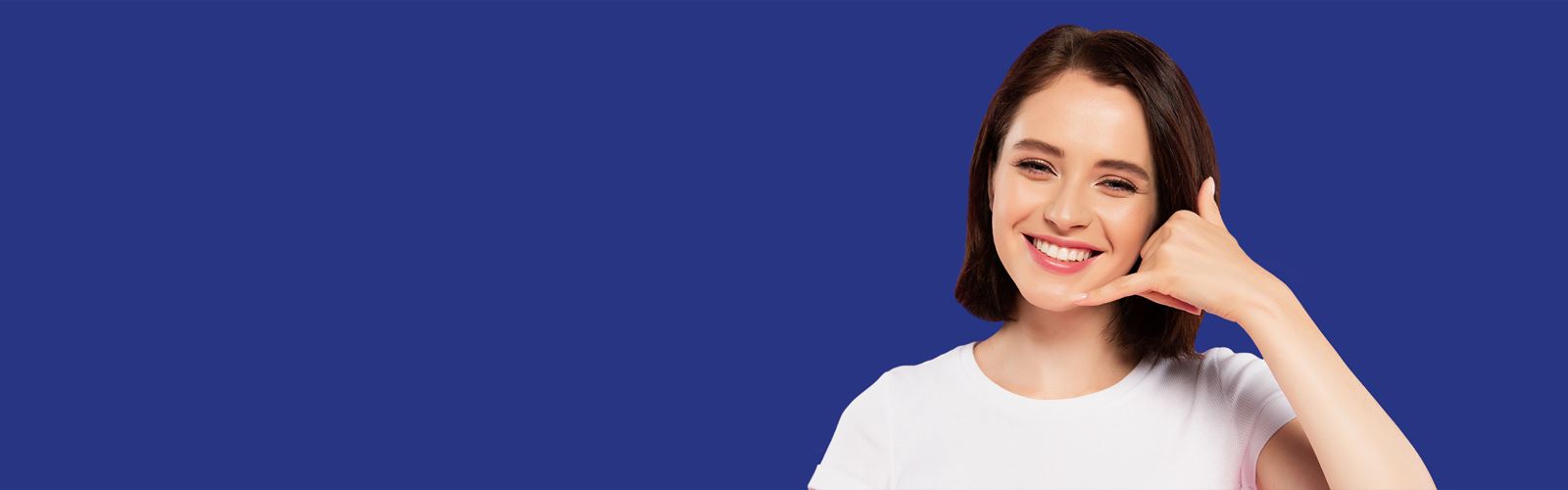 Smiling woman with calling gesture and blue background